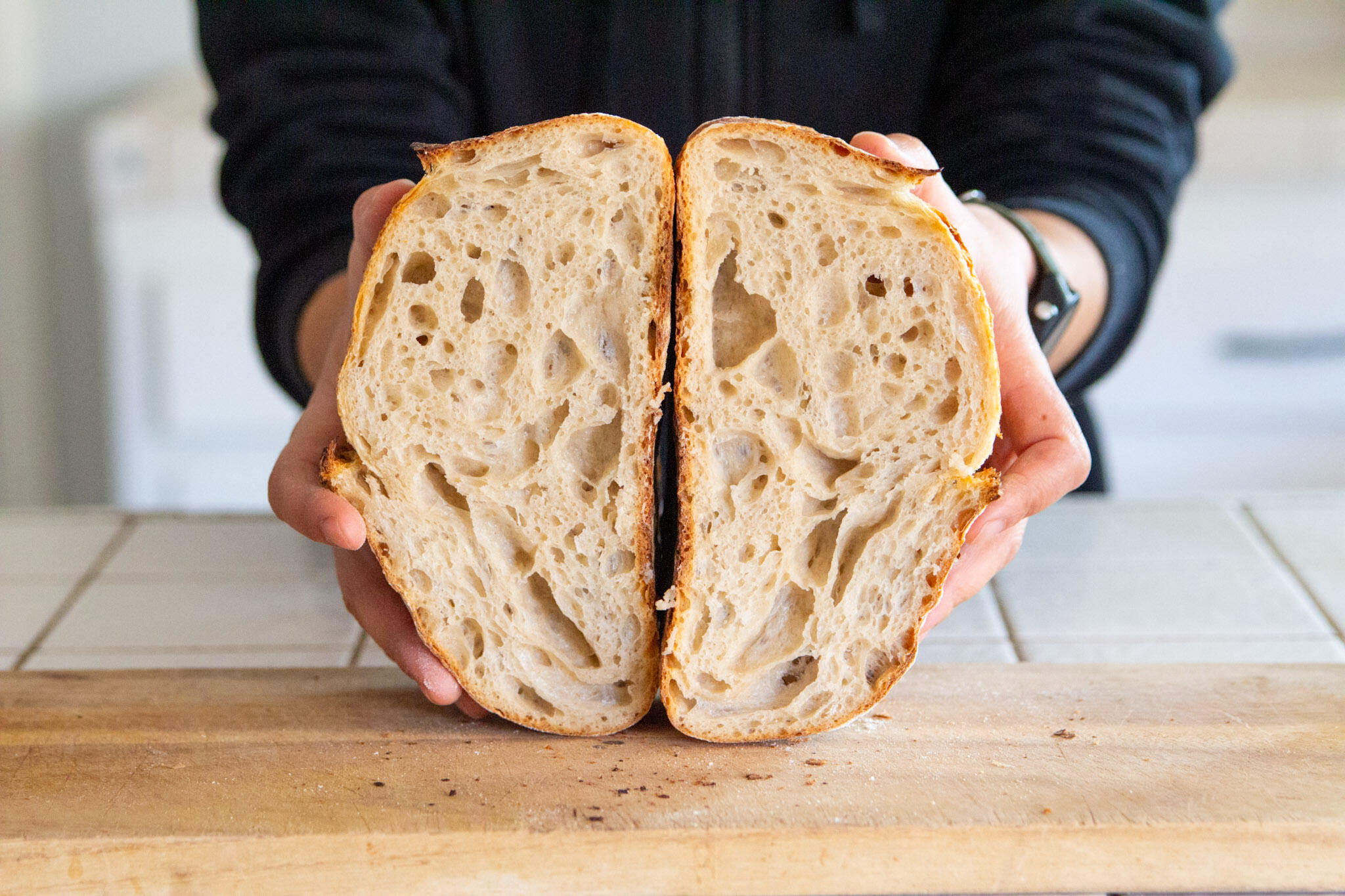 Sourdough Bread Crumb Shot Holding Sourdough Bread showing inside